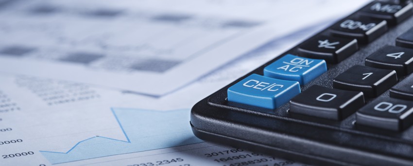 calculator on stack of papers